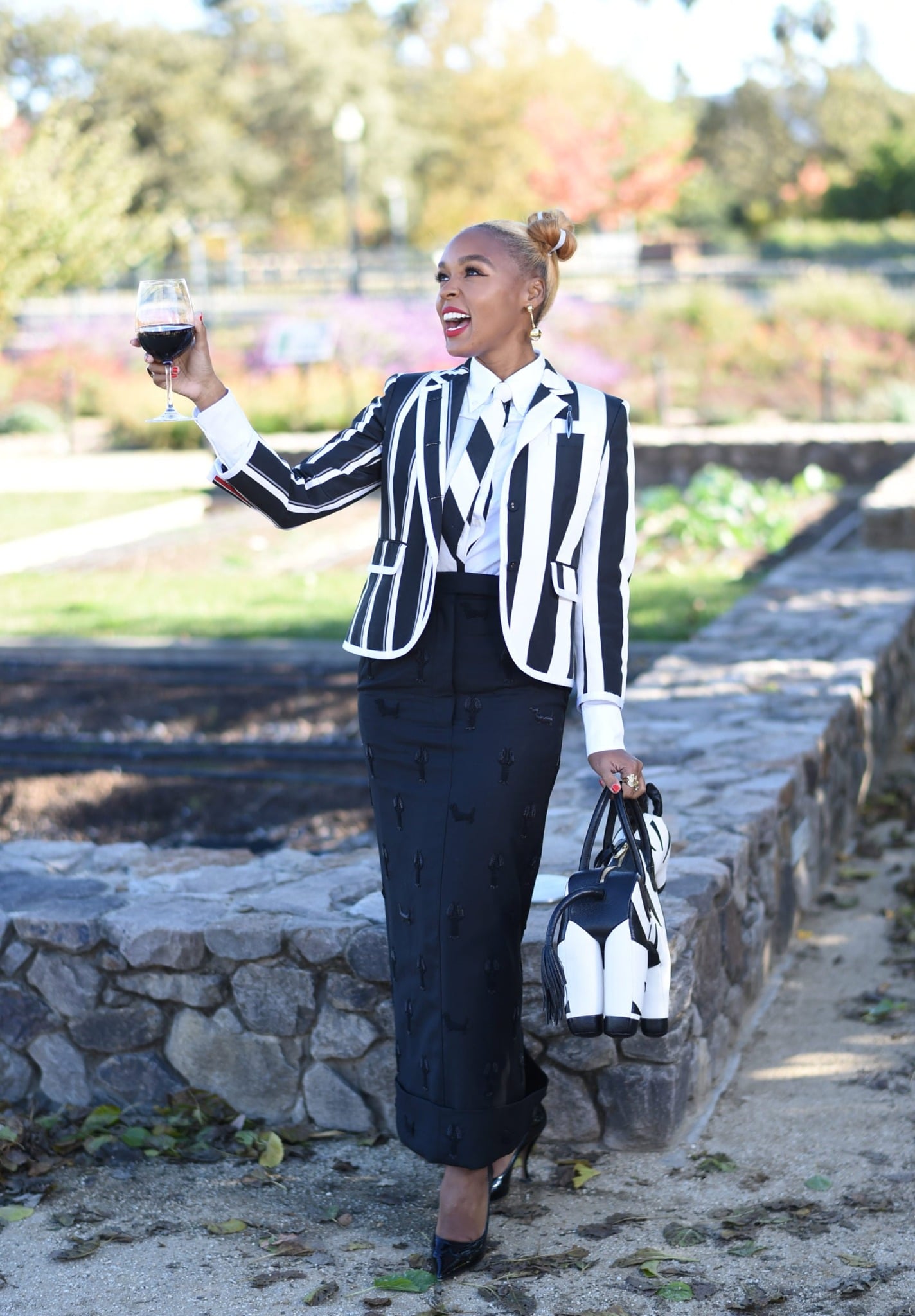 Festival guest raising a glass of Napa Valley wine outdoors